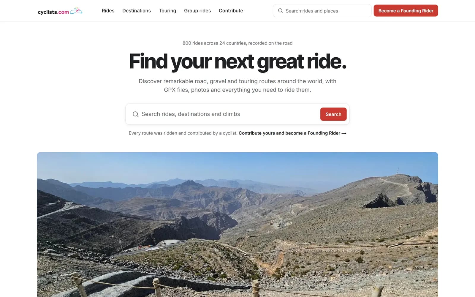 Cyclists.com homepage with a route search box over a mountain road photograph